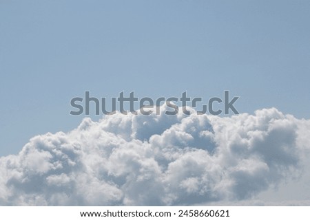 Large winter snow cloud cloudscape background on sunny day