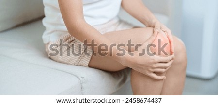 woman having knee ache and muscle pain due to Runners Knee or Patellofemoral Pain Syndrome, osteoarthritis, arthritis, rheumatism and Patellar Tendinitis. medical concept Royalty-Free Stock Photo #2458674437