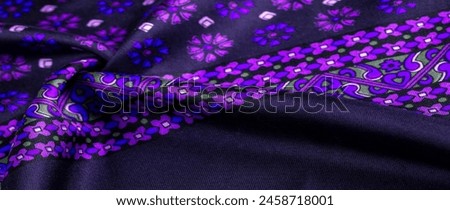 silk fabric of dark blue color with blue and purple flowers, dense fabric, double-sided based on triacetate fibers.