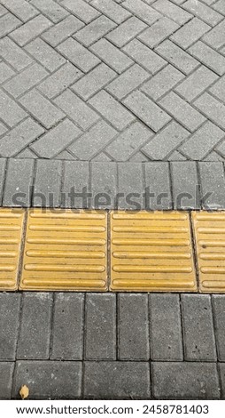 sidewalk with additional lines for the blind
