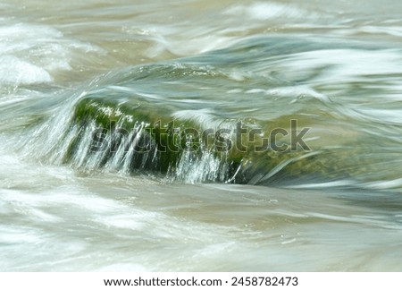 Background, texture. Abstract picture of a turquoise surf wave on the Mediterranean coast
