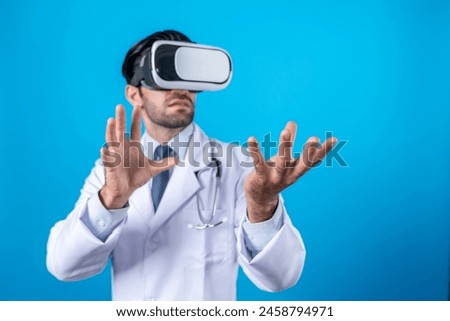 Smart doctor looking VR glass and standing with blue background. Caucasian doctor holding and checking medical data while wearing virtual reality world or metaworld. Innovation technology. Deviation.