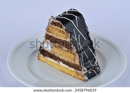 Beautifully decorated chocolates and cakes for birthday and donuts to eat on white backdrop in different angle