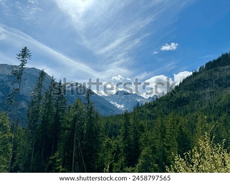 landscape in the mountains sky clouds trees
