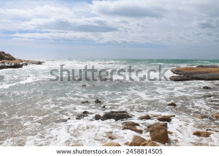 waves on the beach, natural background of sea sky and stones, beautiful view of Mediterranean coast in Spain, waves in the sea