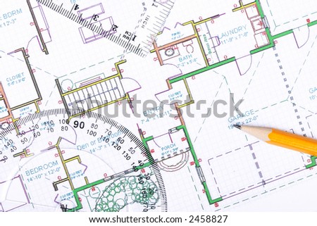 A protractor, pencil and a setsquare on top of a floor plan.
