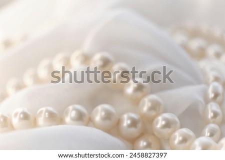 Pearls are scattered gracefully on a light backdrop, their muted glow symbolizing a soft elegance. Their natural essence stands as a tranquil rebellion against today s fast-paced, artificial reality.
