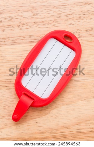 Tag luggage bag on wooden background