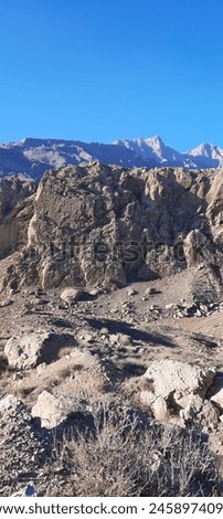 Majestic Mountain Landscape with Breathtaking Views 
Experience the awe-inspiring power of nature with this stunning mountain landscape photo. Towering peaks stretch towards the sky
