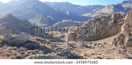 Majestic Mountain Landscape with Breathtaking Views 
Experience the awe-inspiring power of nature with this stunning mountain landscape photo. Towering peaks stretch towards the sky