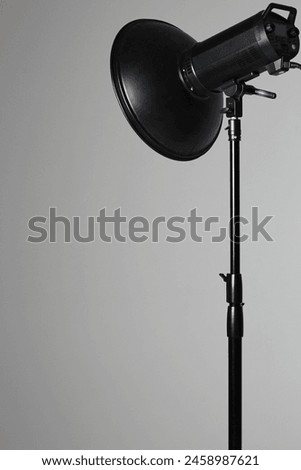 Photo Studio Equipment. Beauty Dish Modifier on White Cyclorama Background. Fashion Shoot Lighting. Fashion Photography.