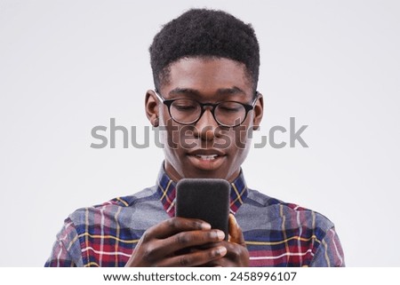 Black man, student and phone for notification in studio, reading and university website for application. Person, social media and internet for survey, communication and dating app on white background