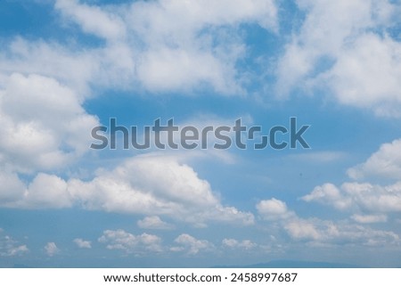 The blue sky is covered with white clouds. White clouds in the blue sky form abstract shapes. for graphic design, 3D rendering