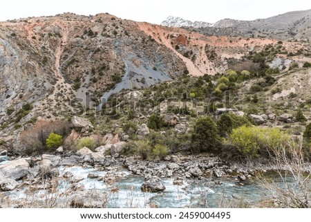 Views from the trekking trail near Lake Iskanderkul to the waterfall in early spring in the Fan Mountains in Tajikistan