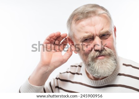 Closeup portrait, senior man, grandfather hard of hearing, placing hand on ear asking someone to speak up, isolated white background. Negative emotion, facial expressions, feelings, reaction, aging Royalty-Free Stock Photo #245900956