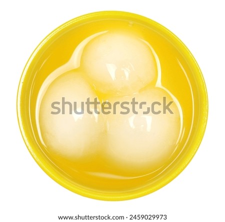 Refreshing orange soft drink in yellow disposable plastic cup isolated on white, top view, clipping