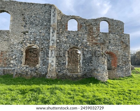 Greyfriers Medieval friary near Dunwich in Suffolk, with empty windows and broken down stone walls, very little remains of this ancient monument. Royalty-Free Stock Photo #2459032729