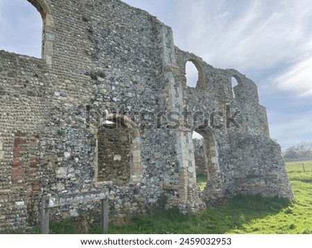Greyfriers Medieval friary near Dunwich in Suffolk, with empty windows and broken down stone walls, very little remains of this ancient monument. Royalty-Free Stock Photo #2459032953
