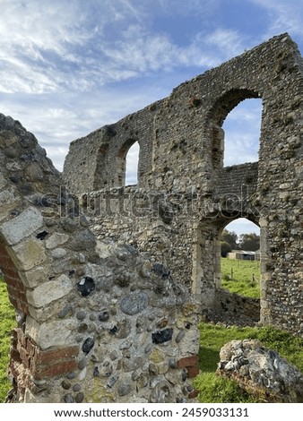 Greyfriers Medieval friary near Dunwich in Suffolk, with empty windows and broken down stone walls, very little remains of this ancient monument. Royalty-Free Stock Photo #2459033131