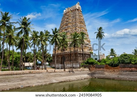Gopura (tower) and temple tank of Lord Bhakthavatsaleswarar Temple. Built by Pallava kings in 6th century. Thirukalukundram (Thirukkazhukundram), near Chengalpet. Tamil Nadu, India Royalty-Free Stock Photo #2459084905