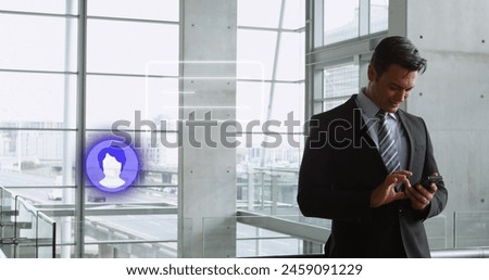 Image of media icon over caucasian businessman using smartphone. Global business and digital interface concept digitally generated image.