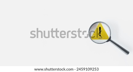 Caution Warning sign,Exclamation marks concept.,Magnifying glass focus on attention or warning information sign on white background with copyspace suitable for alert and beware idea.