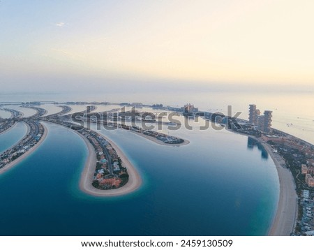 Aerial panoramic view of Palm Jumeirah islands during sunset in Dubai Royalty-Free Stock Photo #2459130509
