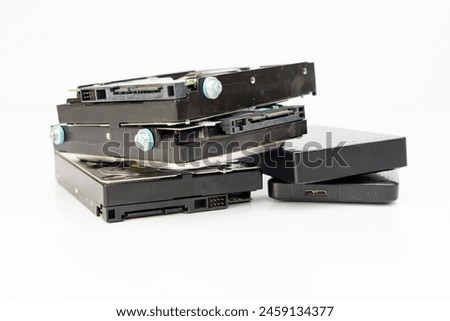 A number of external and internal hard disk drives isolated on white backgroun