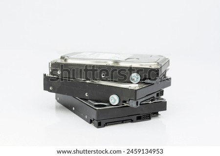 Computer hard disk drives stacked isolated on white background with copy space.