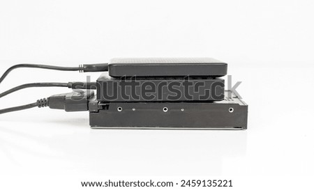 Many external hard disk drives connected to computer or laptop for backup files using USB 3.0 connection isolated on white background
