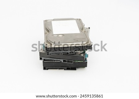 A pile of 3.5 inch computer internal hard disk drives isolated on white background with copy space.
