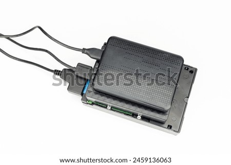 Portable hard disk drives connected to computer isolated on white background. top view.