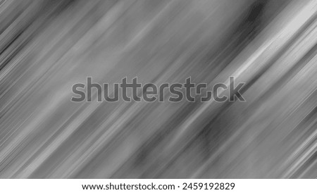A dynamic, monochromatic image featuring streaks of gray with a sense of motion and fluidity, ideal for backgrounds.