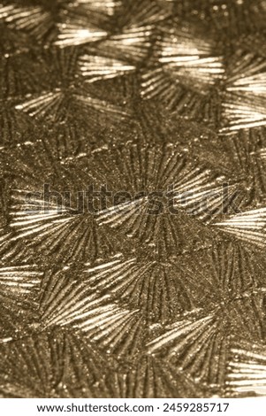 A Shiney Metallic Glitter Shaped Background with Geometric Design