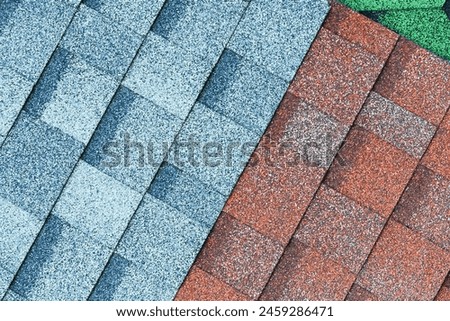 It's close up view of mosaic colorful tile. It is the photo of green, blue and a brown roof tiles. It is view of multicolored texture of tiles.