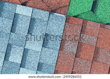 It's close up view of mosaic colorful tile. It is photo of green, blue and brown roof tiles. It is view of multicolored texture of tiles.