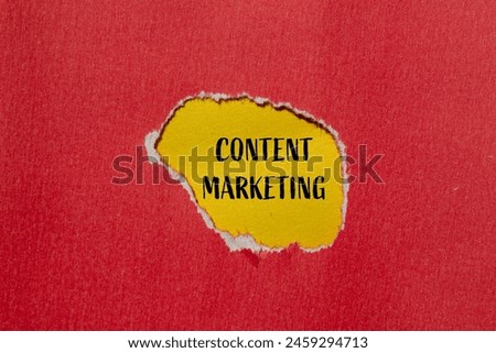 Content marketing words written on ripped red paper with yellow background. Conceptual content marketing symbol. Copy space.
