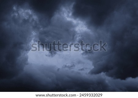 dramatic dark clouds in the sky, dark storm clouds in a dark sky before rain,beautiful landscape with cloudy sky