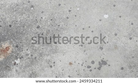 Spilled paint on cement floor texture: A rugged surface with scattered splatters of vibrant color, juxtaposing urban grit with artistic flair, ideal for contemporary designs seeking a touch of spontan Royalty-Free Stock Photo #2459334211