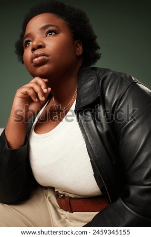 Studio, black woman and thinking by green background of fashion ideas, planning and pride. Female model, thoughts and stylish with casual outfit, organic cotton or leather for cool or trendy look