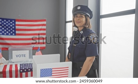 A confident hispanic policewoman oversees a us polling station adorned with american flags and voting booths. Royalty-Free Stock Photo #2459360049