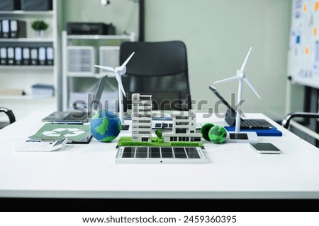 Work place concept : model building at company office working technology, Renewable energy-based green businesses and global warming.