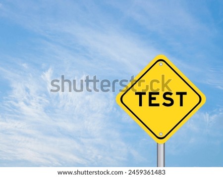 Yellow transportation sign with word test on blue color sky background
