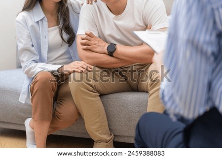 psychologist talking with a couple during mental therapy.