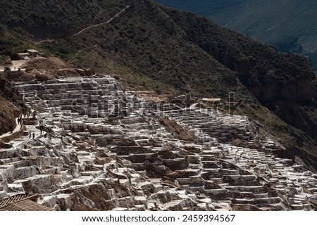 Mountain with salt terraces in the reserve called Salineras de Maras in the Sacred Valley in Peru.