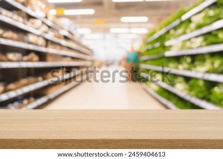 Light wooden board empty table in front of blurred background. Perspective light wood over blur in supermarket. mock up used for display or montage your products. Wood floor and Supermarket blur.