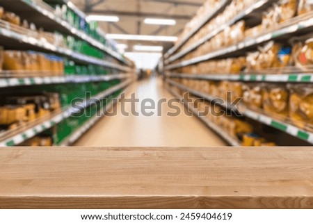Light wooden board empty table in front of blurred background. Perspective light wood over blur in supermarket. mock up used for display or montage your products. Wood floor and Supermarket blur.