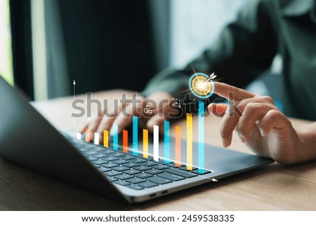 Businesswoman calculates financial data for long-term investment, Businesswoman analyzing company's business financial balance sheet working with digital augmented reality graphics.