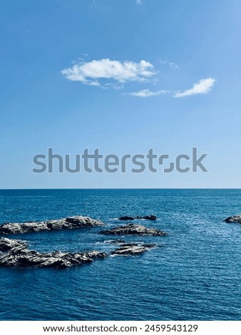 Seaview with a blue sky in a sunny day Royalty-Free Stock Photo #2459543129