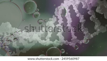 Image of bubbles over dna strand on blurred background. Science, medicine and digital interface concept digitally generated image.